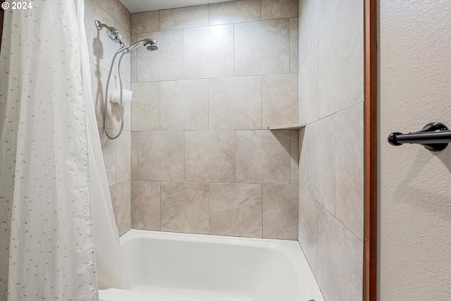 bathroom featuring shower / bathtub combination with curtain