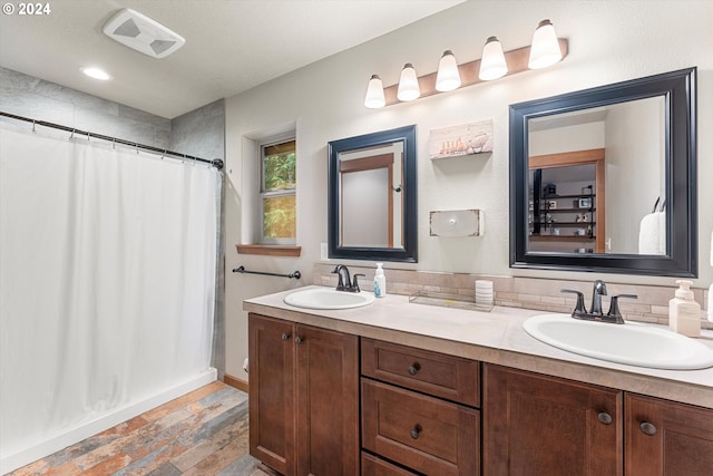 bathroom with vanity, a shower with curtain, and wood-type flooring