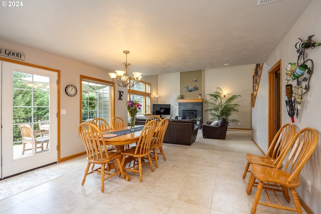 dining space with a notable chandelier