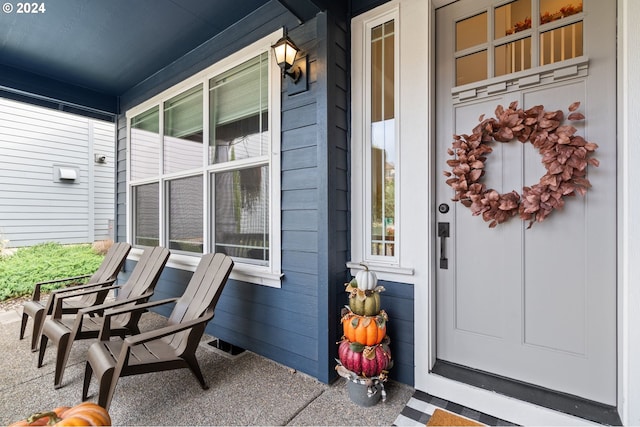 property entrance with covered porch