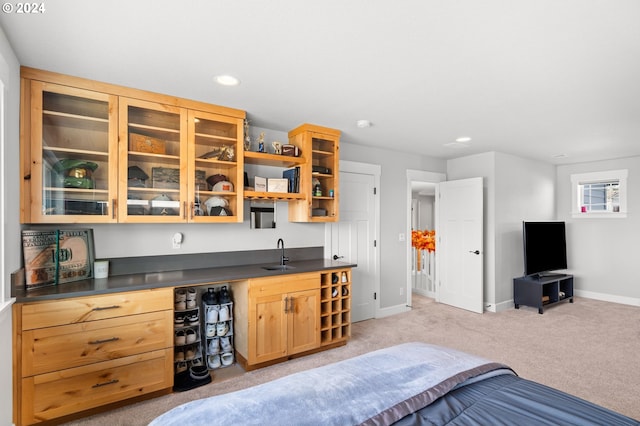 carpeted bedroom featuring wet bar