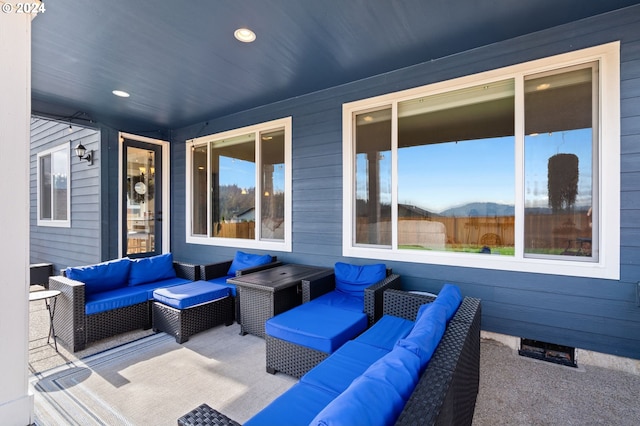 view of patio with a mountain view and outdoor lounge area