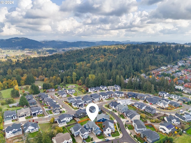 birds eye view of property with a mountain view