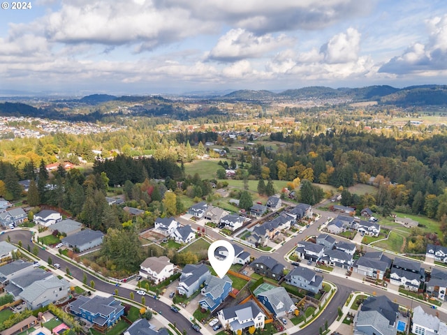 birds eye view of property featuring a mountain view