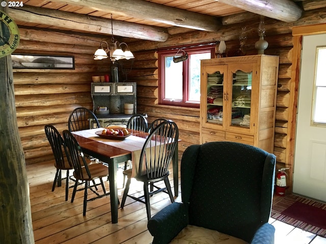60020 Wilderness Rd, Joseph, OR 97846 - dining room with a chandelier, log walls, and wooden ceiling with exposed beams