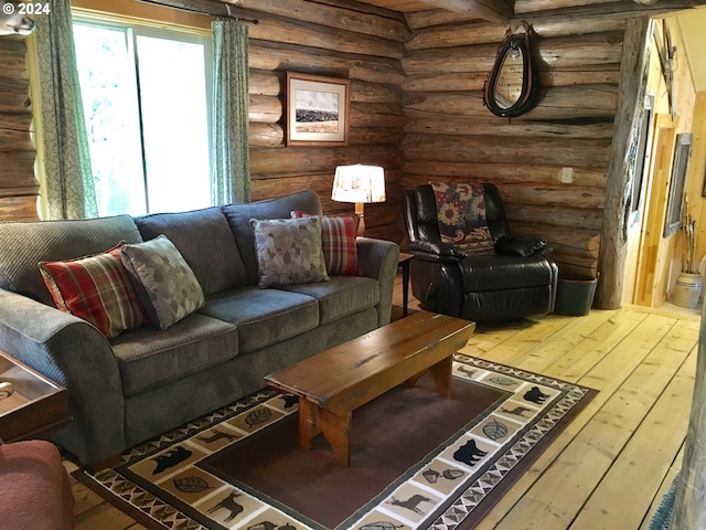 60020 Wilderness Rd, Joseph, OR 97846 - living room featuring rustic walls and wood-type flooring
