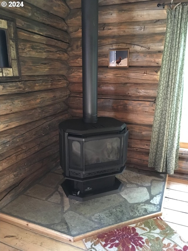 60020 Wilderness Rd, Joseph, OR 97846 - detailed view of a wood stove and rustic walls