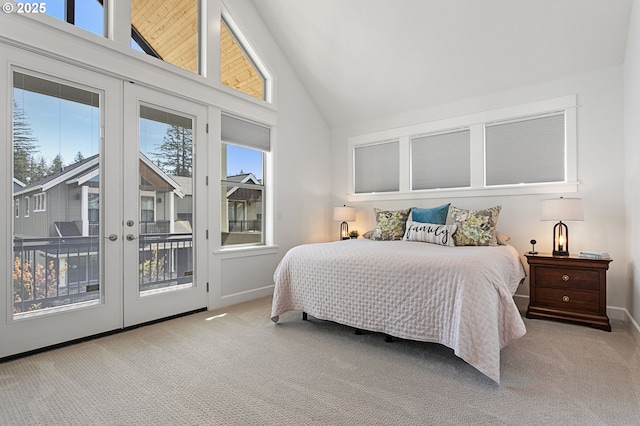 bedroom with baseboards, carpet floors, french doors, access to exterior, and high vaulted ceiling