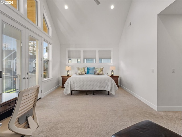 bedroom with access to exterior, light carpet, high vaulted ceiling, and french doors