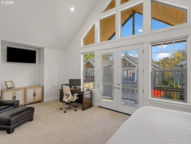 carpeted bedroom featuring access to outside, french doors, high vaulted ceiling, and baseboards