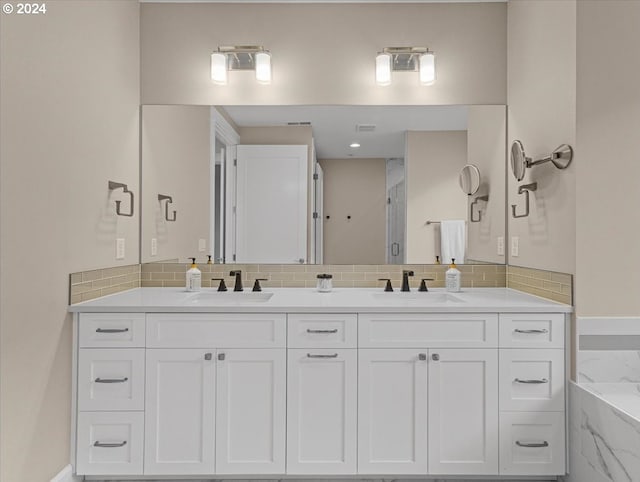 bathroom featuring decorative backsplash, vanity, and independent shower and bath