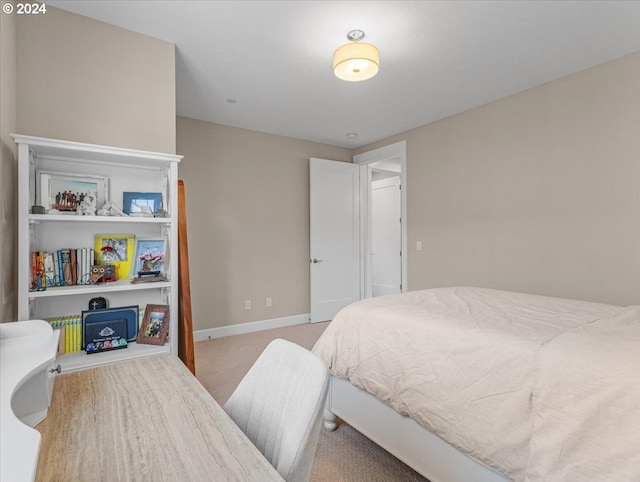 bedroom with light colored carpet