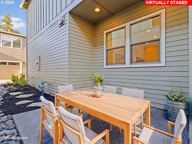 view of patio featuring outdoor dining area