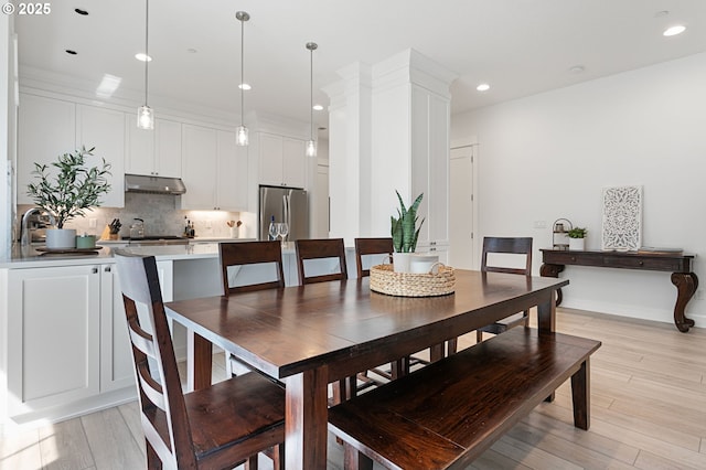 dining area featuring recessed lighting and light wood-style floors