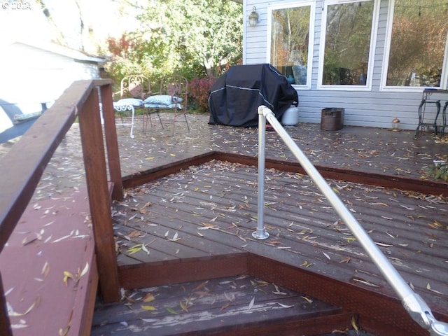 exterior space featuring a wooden deck and grilling area