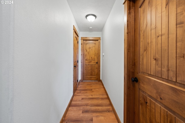 corridor featuring hardwood / wood-style flooring