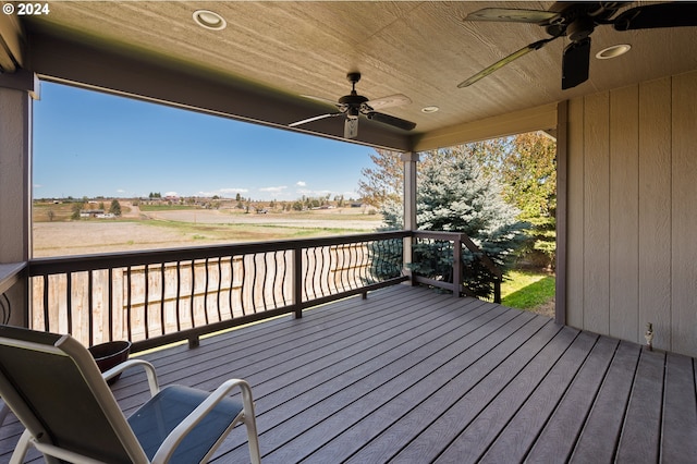 wooden terrace featuring ceiling fan