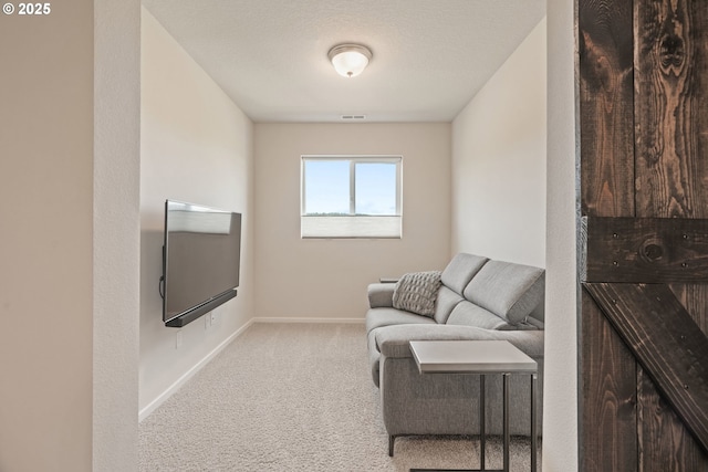 living area with carpet and baseboards