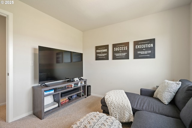 living room featuring carpet and baseboards