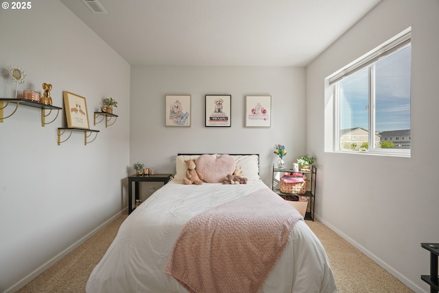 carpeted bedroom with baseboards