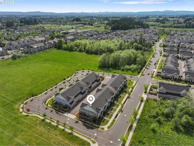 aerial perspective of suburban area featuring a mountain backdrop