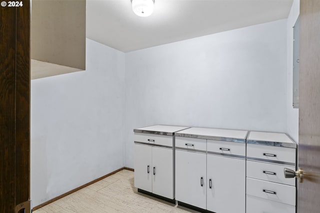 interior space featuring white cabinets