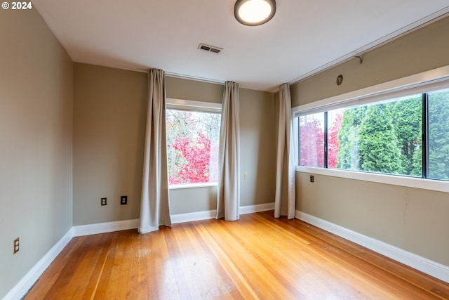 unfurnished room featuring light hardwood / wood-style flooring