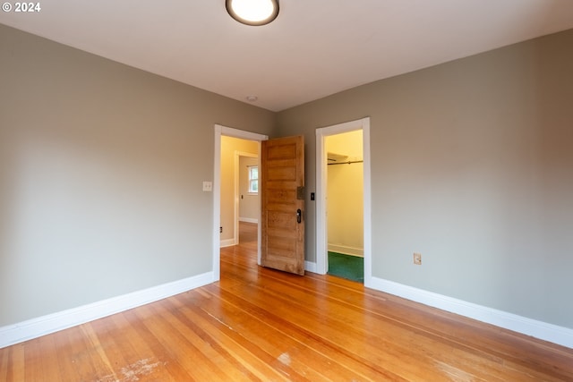 spare room with light hardwood / wood-style floors