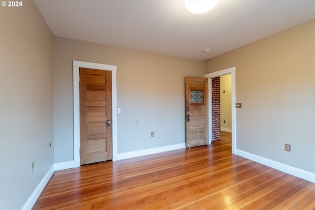 unfurnished bedroom with wood-type flooring