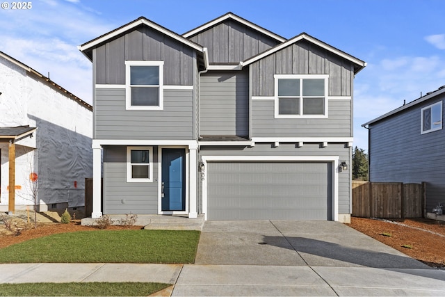 view of front of home featuring driveway, an attached garage, board and batten siding, and fence