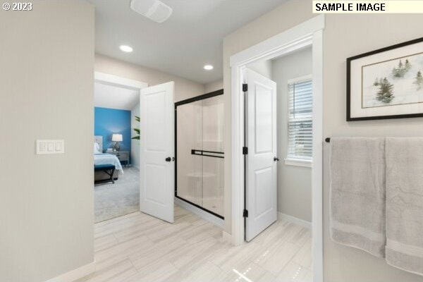 bathroom featuring an enclosed shower