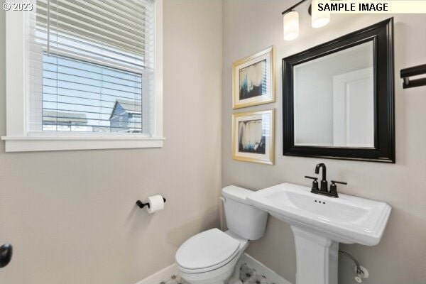 bathroom featuring sink and toilet