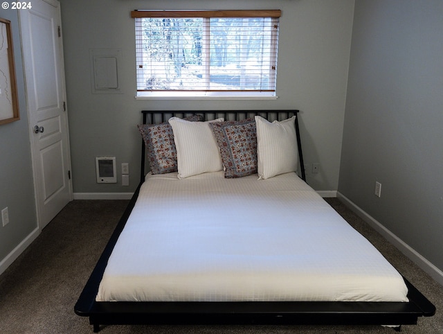 bedroom with dark colored carpet