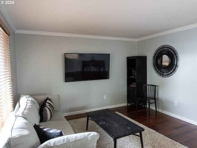 living room with hardwood / wood-style flooring and crown molding