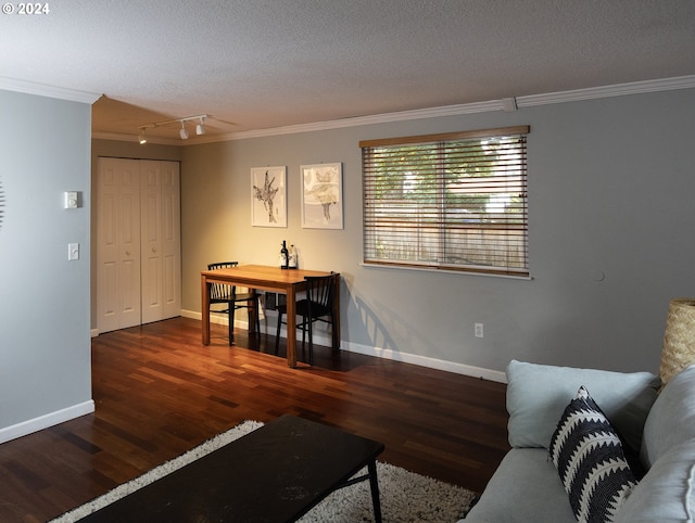 living room featuring a textured ceiling, crown molding, and dark hardwood / wood-style floors