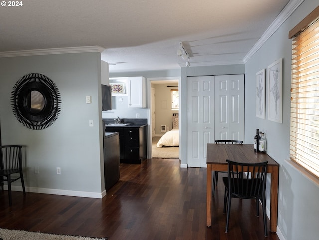 kitchen with white cabinets, dark hardwood / wood-style flooring, and a healthy amount of sunlight