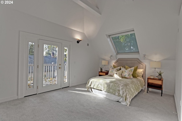 bedroom with access to outside, vaulted ceiling with beams, and light colored carpet