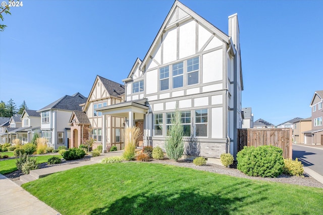 tudor house with a front lawn