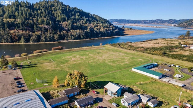 drone / aerial view with a water and mountain view