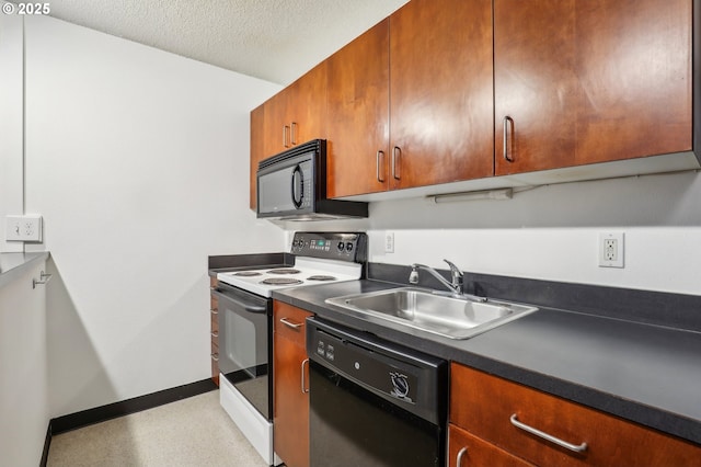 kitchen with black appliances, sink, and a textured ceiling