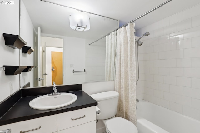 full bathroom featuring shower / bath combo with shower curtain, vanity, and toilet