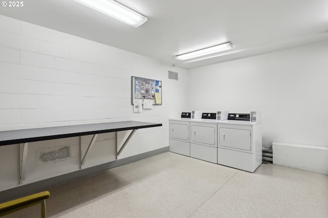 washroom featuring washer and clothes dryer