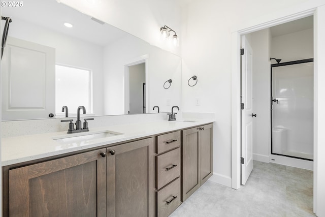 bathroom with vanity and walk in shower