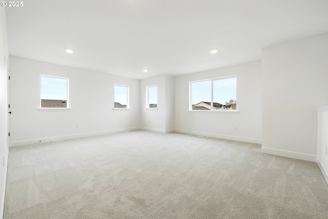 empty room with light colored carpet