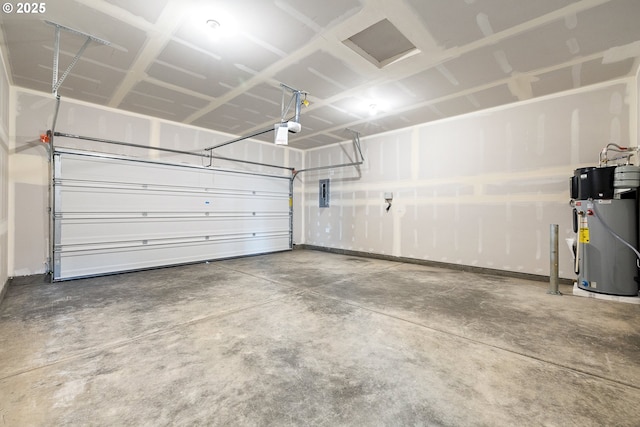 garage with a garage door opener, hybrid water heater, and electric panel