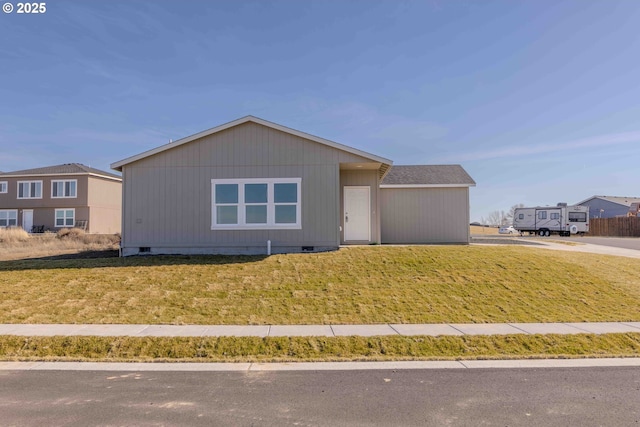 view of front of home with crawl space and a front yard