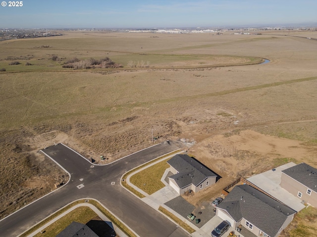 birds eye view of property featuring a rural view