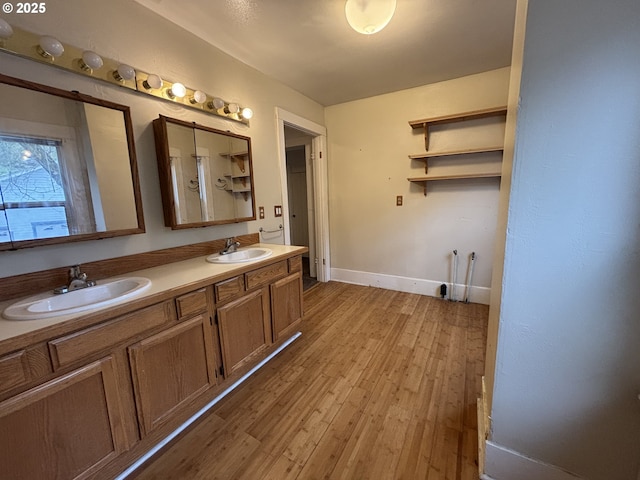 bathroom featuring wood-type flooring and vanity