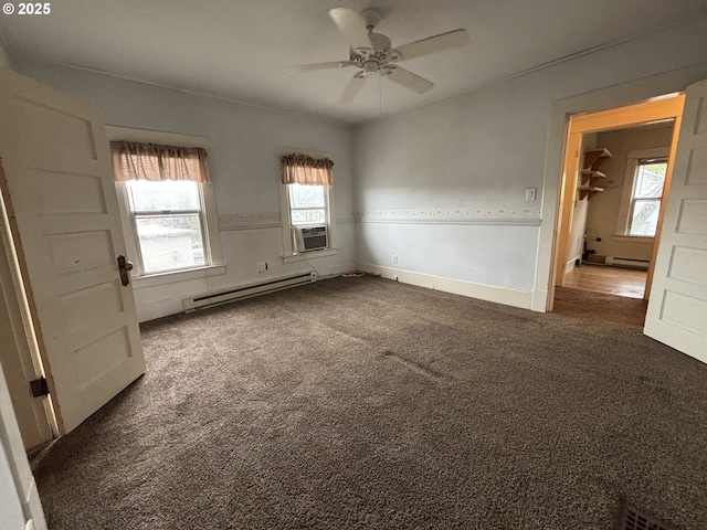 empty room with baseboard heating, ceiling fan, cooling unit, and dark colored carpet