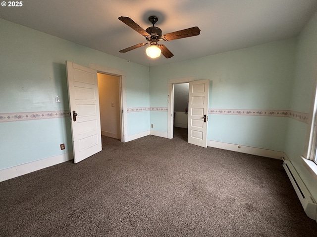 unfurnished bedroom featuring dark carpet, ceiling fan, and a baseboard heating unit